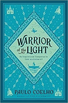 The cover of Warrior of the Light: A Manual by Paulo Coelho is blue-green with ornate patterns, symbols, and a figure in a boat. The subtitle states: An Inspirational Companion to The Alchemist.