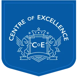 Blue shield-shaped logo with Centre of Excellence written in white above a crest featuring two rearing horses, a crown, and the initials CoE in the center, representing the prestigious Centre of Excellence. Holistic Living Courses
