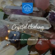 Colorful crystals and gemstones are displayed on a reflective surface, with the text Crystal Healing Diploma Course demonstrating how to harness their healing powers. A blue Centre of Excellence emblem is shown at the top.
