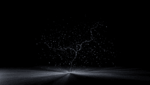 A dark, abstract scene with fine white particles suspended in midair, forming a delicate, branching pattern above a softly illuminated surface. The overall mood is mysterious and minimalistic—Sensate for those who seek to experience absolute relaxation.