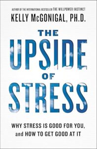 Book cover for The Upside of Stress by Kelly McGonigal, PhD, with blue sky and clouds in bold letters. Subtitle: Why Stress Is Good for You, and How to Get Good at It.